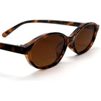 GUVIVI Retro Oval Sunglasses for Women Chic Cat Eye 90s Sunnies Lightweight Narrow Shades Trendy UV protection Sun Glasses Leopard Frame - Brown Lens