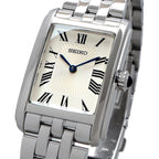 Seiko Swr083 Rectangular Watch - Essentials Collection - Roman Numeral Dial, Blue Hands, Stainless Steel Bracelet, And 50M Water Resistance