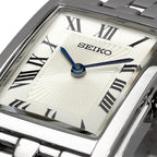 Seiko Swr083 Rectangular Watch - Essentials Collection - Roman Numeral Dial, Blue Hands, Stainless Steel Bracelet, And 50M Water Resistance