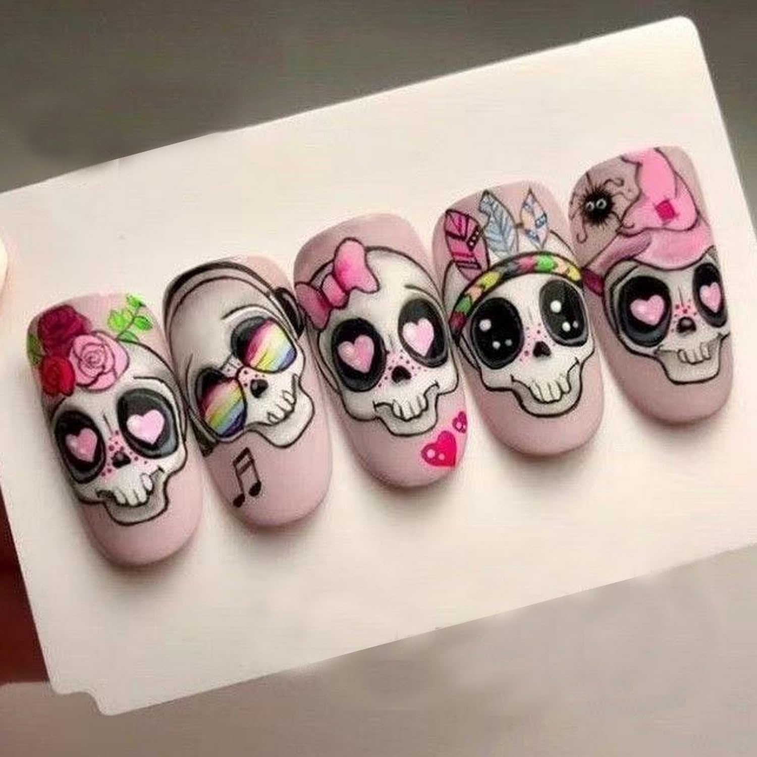 24 Pcs Halloween Press on Nails Short Almond Fake Nail with Cute Skull Flower and heart Designs Full Cover Pink Acrylic Nails Matte Halloween Stick on Nail for Women Nail Manicure Decoration