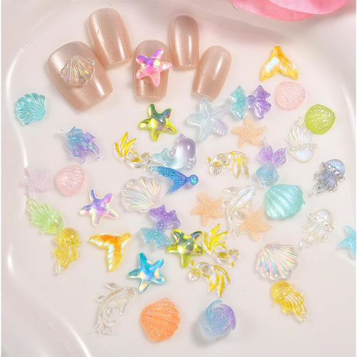 100Pcs Ocean Series Nails Charms 3D Colorful Seashell Jellyfish Starfish Nail Rhinestones Resin Summer Flat Nail Art Supplies for Acrylic Nails Dolphin Mermaid Nail Charms for Women Summer DIY