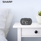 Sharp Digital Alarm Clock – Tactile Plastic Case With Soft Rubberized Finish - Battery Operated – Blue Backlight On Demand – Ascending Alarm – Easy To Use – Charcoal Black