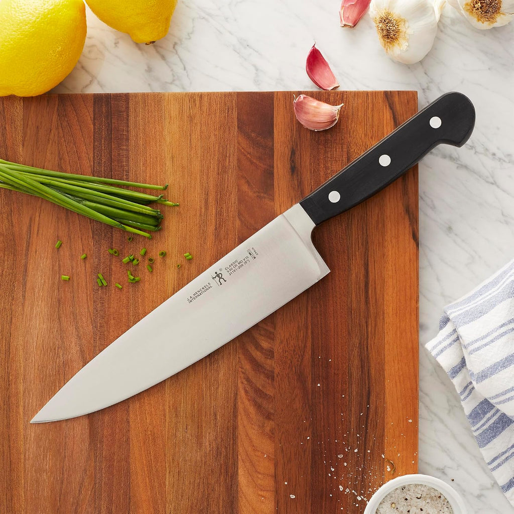 Henckels Classic 8-Inch Chef Knife, Razor-Sharp, German Engineered | Fully Forged Construction Provides Balance With Traditional Triple-Rivet Handles Enables Comfortable Easy Cutting.