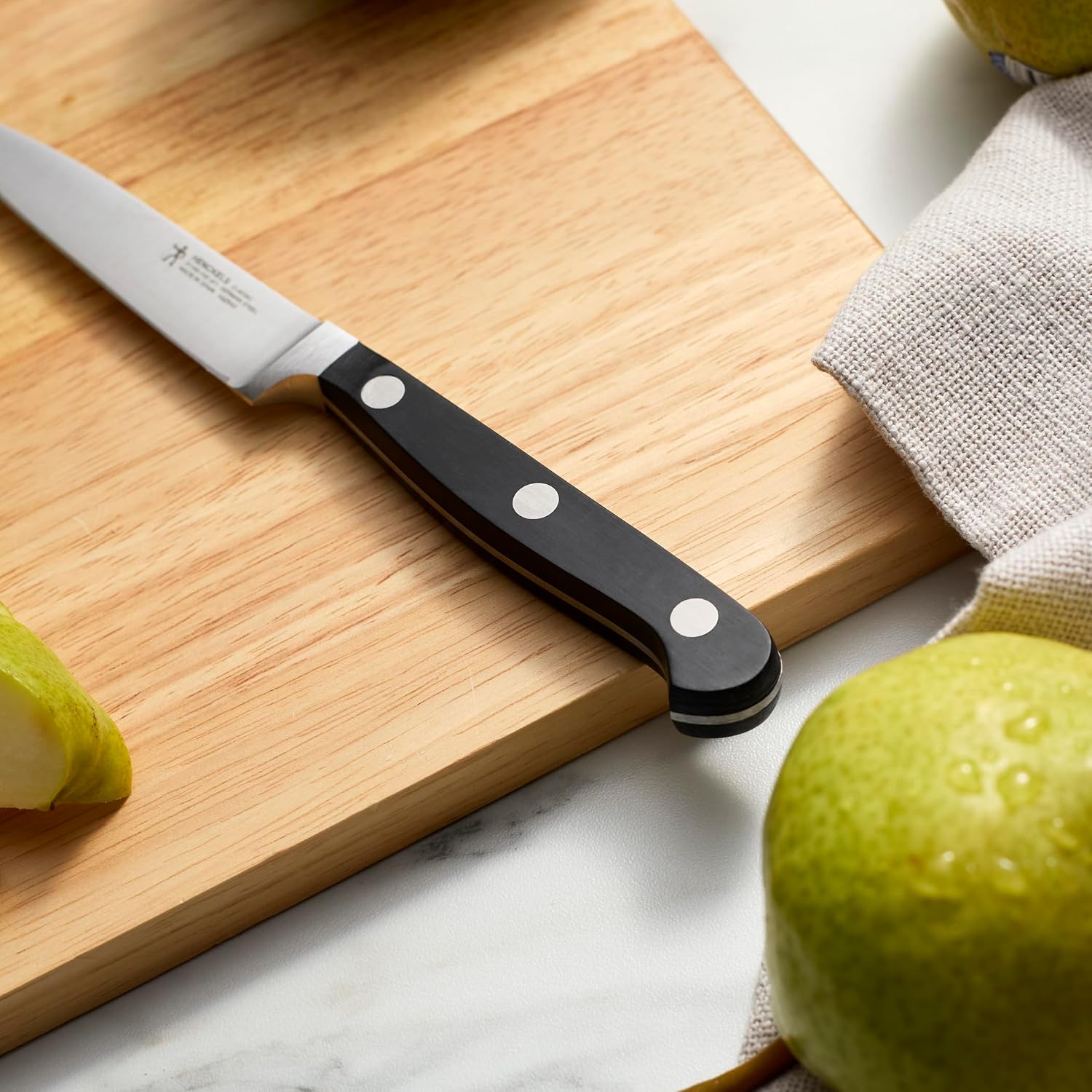 Henckels Classic 4-Inch Paring Knife, Razor-Sharp, German Engineered | Fully Forged Construction Provides Balance With Traditional Triple-Rivet Handles Enables Comfortable Easy Cutting.