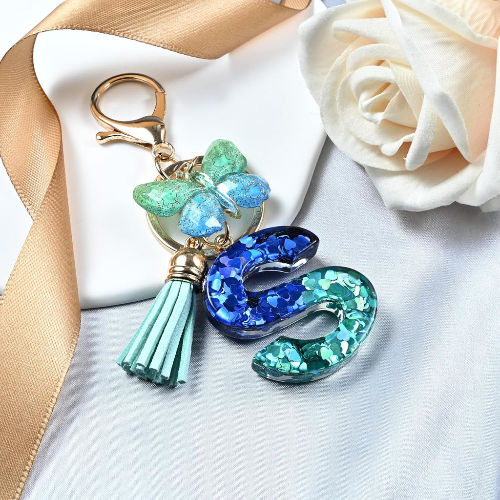 JINGUAZI Initial letter Keychains for Women Tassel Butterfly Pink Purple Cute Car Keychain for Wallet Backpack bag charm