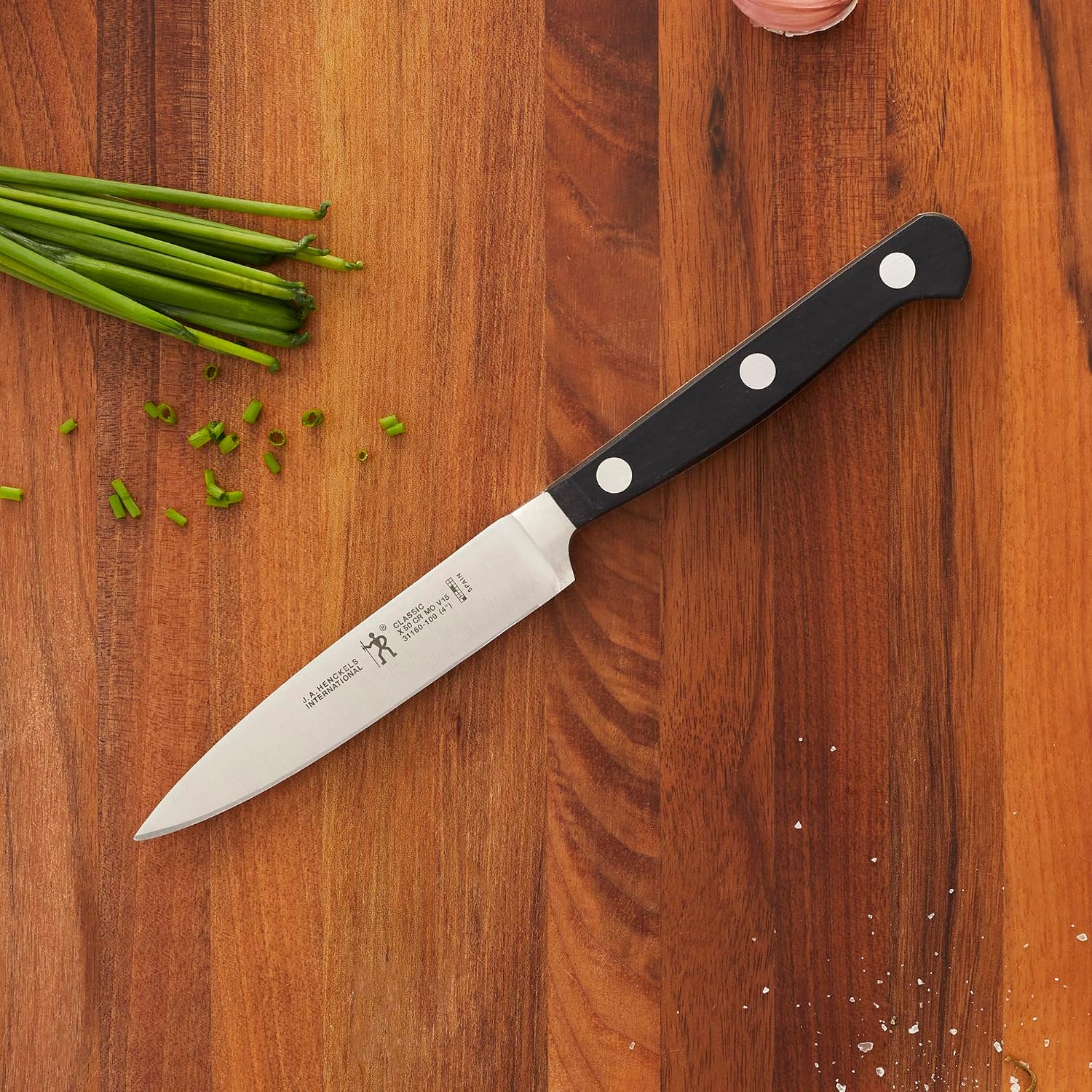 Henckels Classic 4-Inch Paring Knife, Razor-Sharp, German Engineered | Fully Forged Construction Provides Balance With Traditional Triple-Rivet Handles Enables Comfortable Easy Cutting.